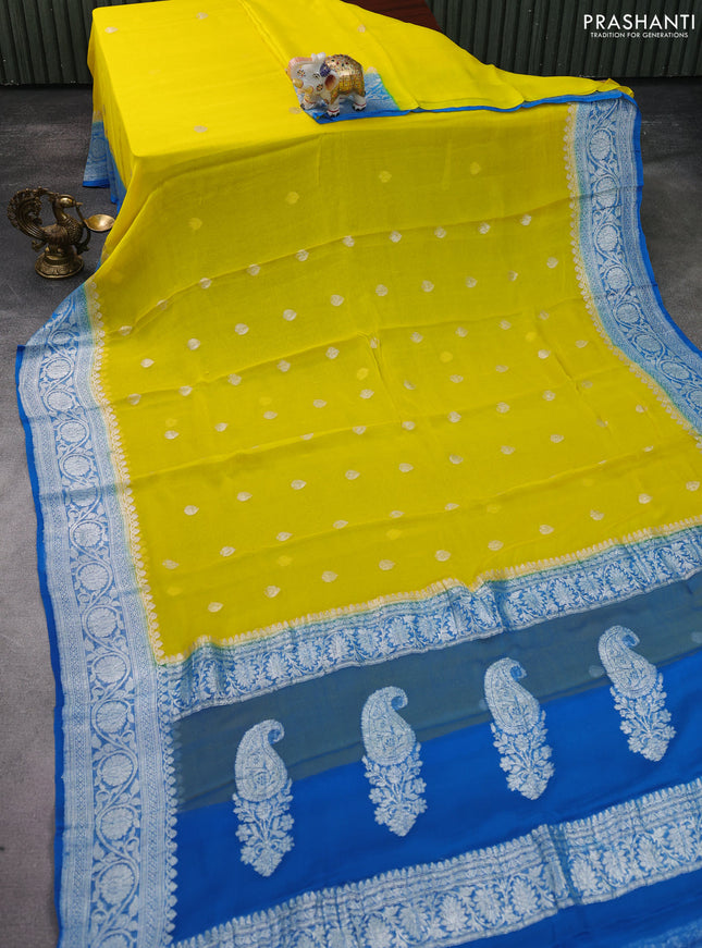 Banarasi chiffon silk saree yellow and cs blue with silver zari woven buttas and silver zari woven floral border