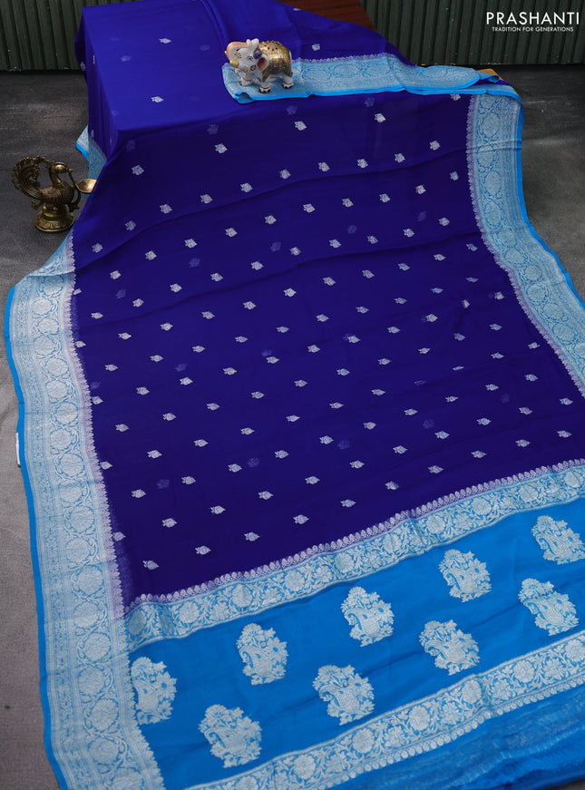 Banarasi chiffon silk saree blue and cs blue with silver zari woven buttas and silver zari woven floral border