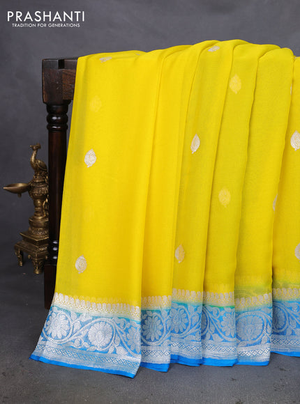 Banarasi chiffon silk saree yellow and cs blue with silver zari woven buttas and silver zari woven floral border