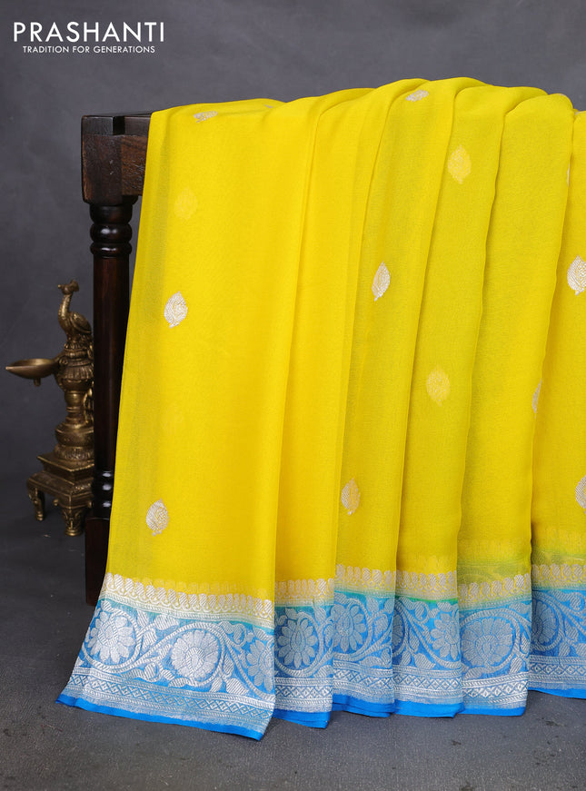 Banarasi chiffon silk saree yellow and cs blue with silver zari woven buttas and silver zari woven floral border