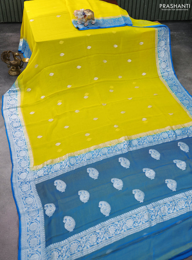 Banarasi chiffon silk saree yellow and cs blue with silver zari woven buttas and silver zari woven floral border