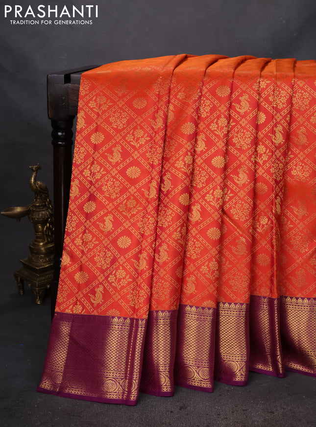Pure kanchipuram silk saree orange and purple with allover zari woven brocade weaves and zari woven border