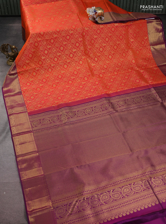Pure kanchipuram silk saree orange and purple with allover zari woven brocade weaves and zari woven border