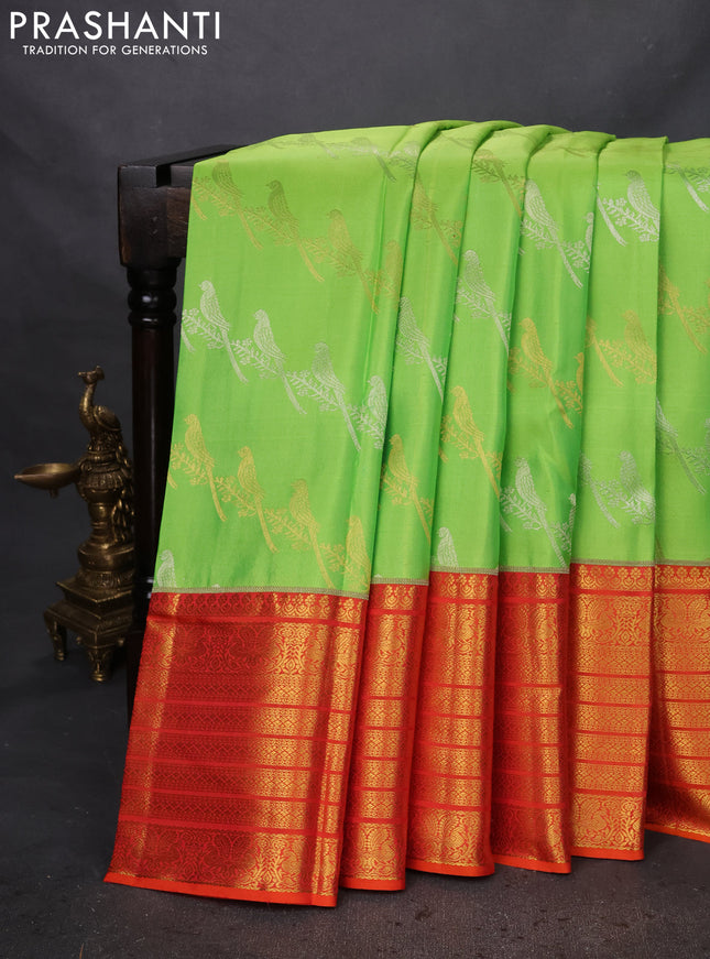 Pure kanchipuram silk saree fluorescent green and orange with silver & gold zari woven bird weaves and long zari woven korvai border