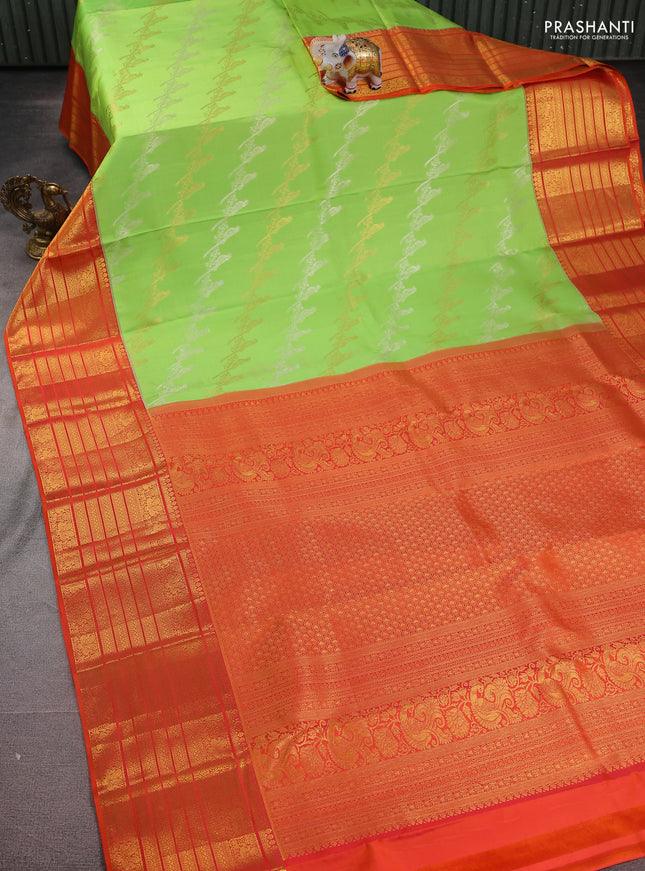 Pure kanchipuram silk saree fluorescent green and orange with silver & gold zari woven bird weaves and long zari woven korvai border