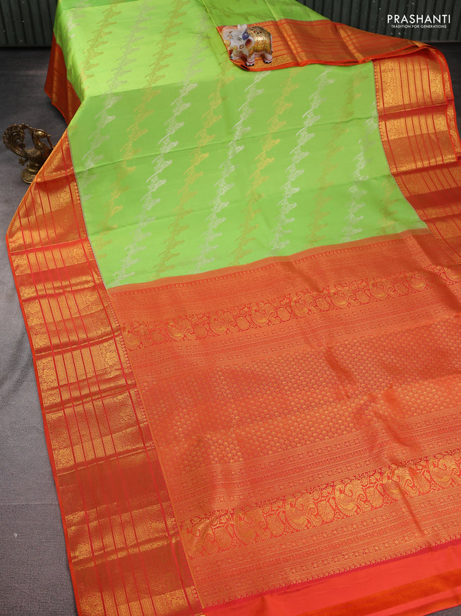 Pure kanchipuram silk saree fluorescent green and orange with silver & gold zari woven bird weaves and long zari woven korvai border