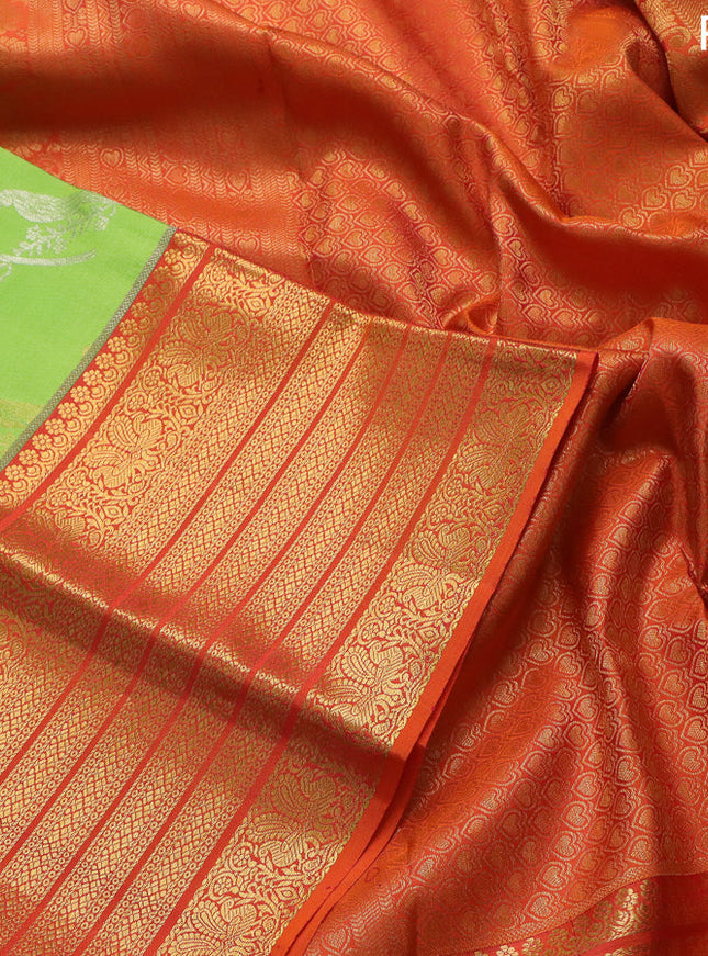 Pure kanchipuram silk saree fluorescent green and orange with silver & gold zari woven bird weaves and long zari woven korvai border