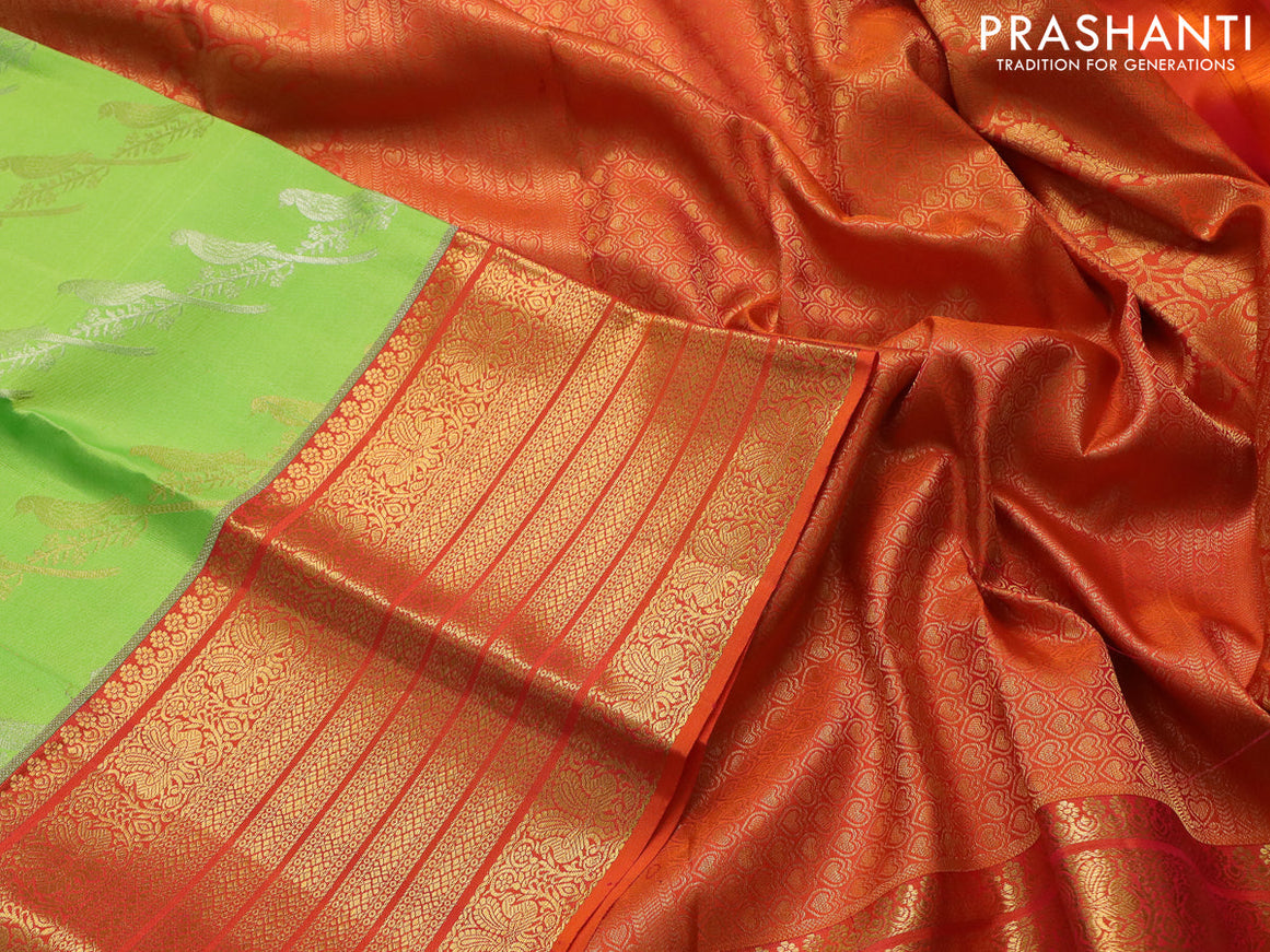 Pure kanchipuram silk saree fluorescent green and orange with silver & gold zari woven bird weaves and long zari woven korvai border