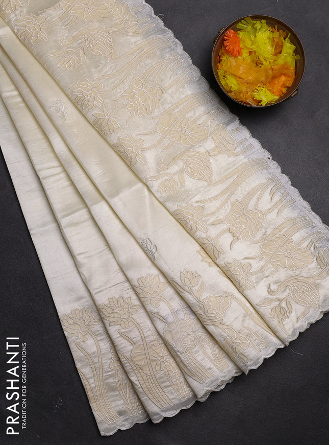 Semi tussar saree off white with floral embroidery work and applique work border