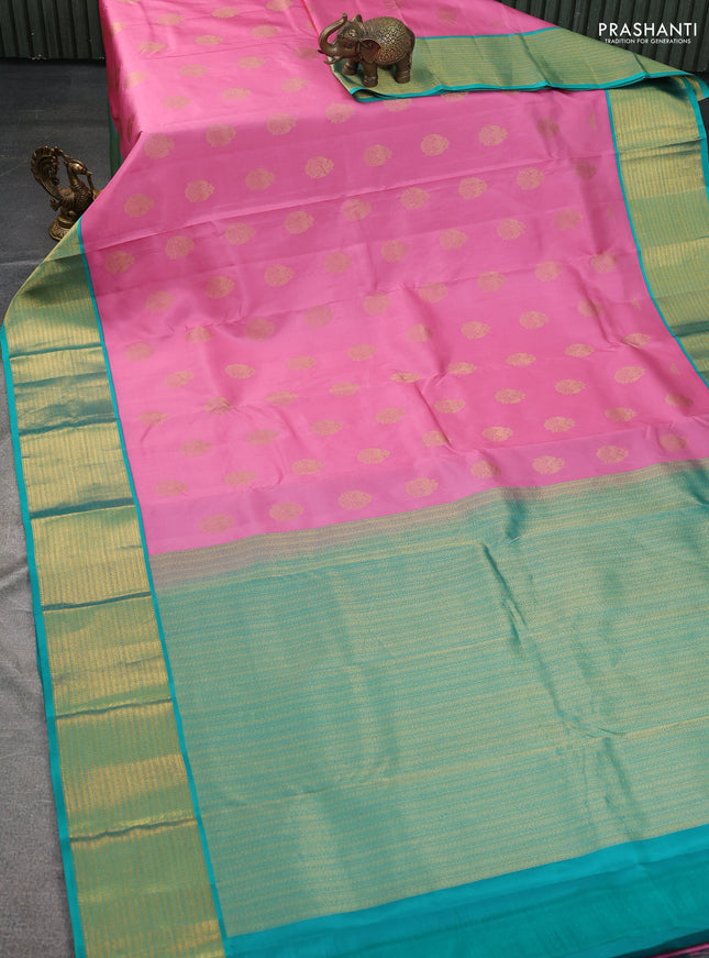 Pure kanchipuram silk saree light pink and teal green with zari woven peacock buttas and zari woven korvai border
