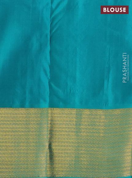Pure kanchipuram silk saree light pink and teal green with zari woven peacock buttas and zari woven korvai border