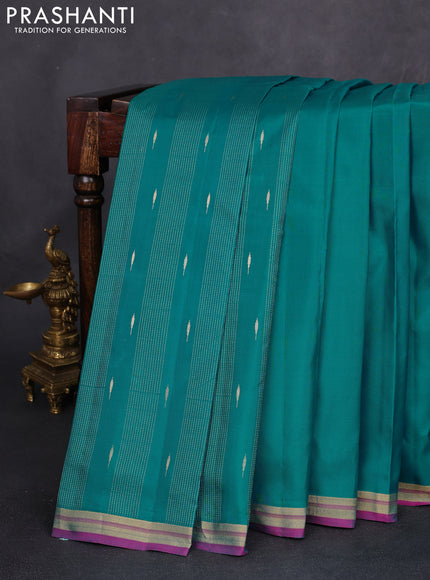 Pure kanchipuram silk saree teal blue and pink with plain body and zari woven border