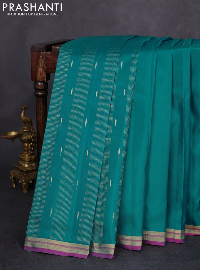 Pure kanchipuram silk saree teal blue and pink with plain body and zari woven border