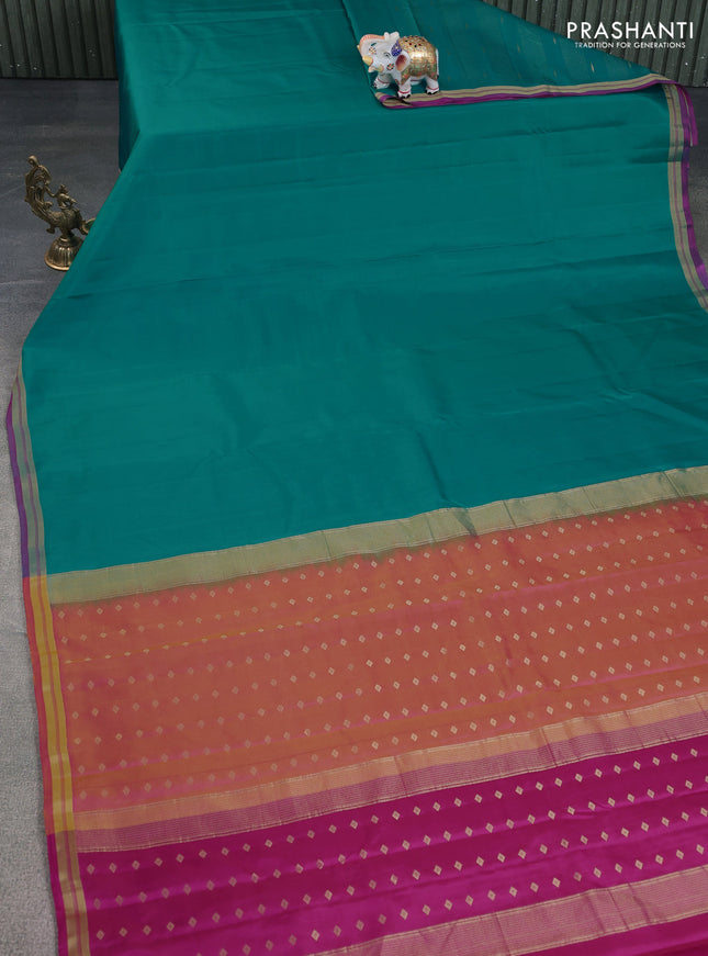 Pure kanchipuram silk saree teal blue and pink with plain body and zari woven border