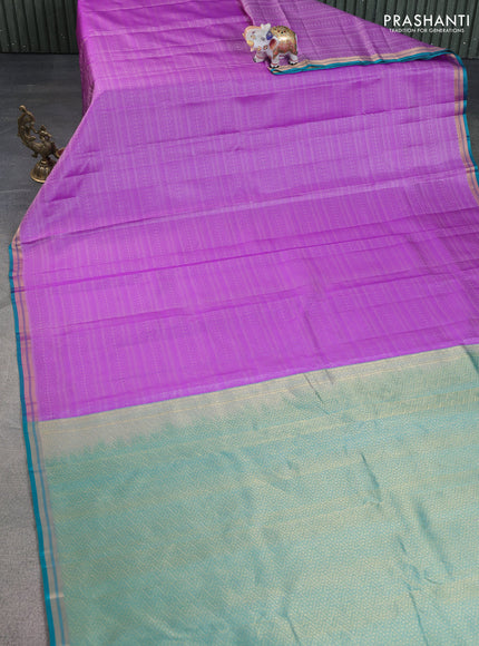 Pure kanchipuram silk saree lavender and teal green with allover self emboss and zari woven border