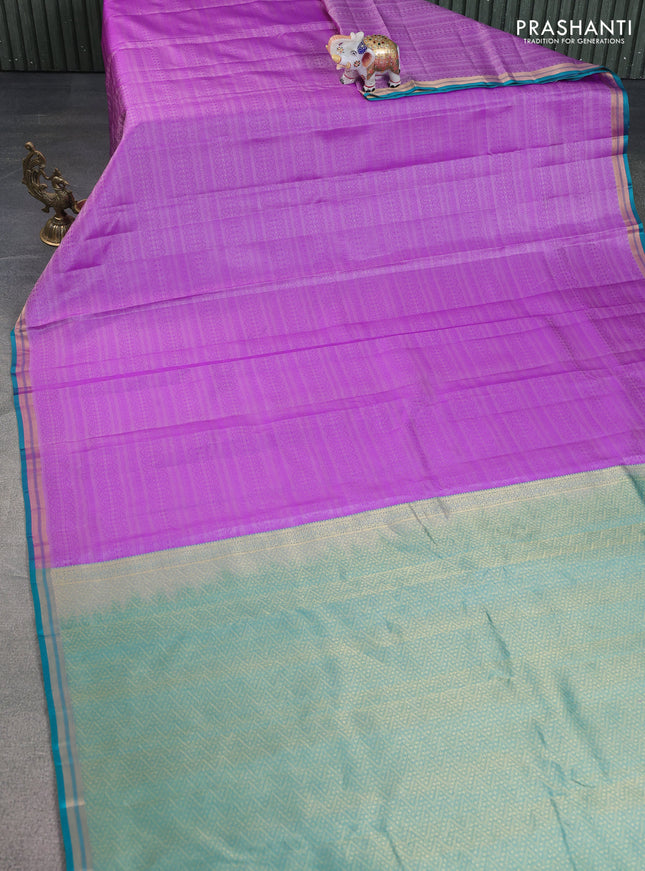Pure kanchipuram silk saree lavender and teal green with allover self emboss and zari woven border