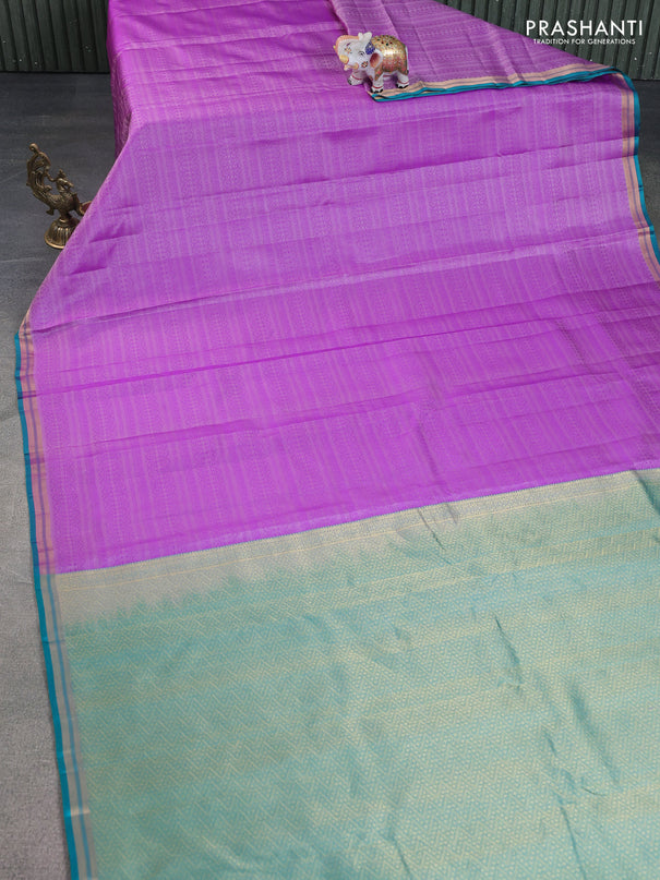 Pure kanchipuram silk saree lavender and teal green with allover self emboss and zari woven border