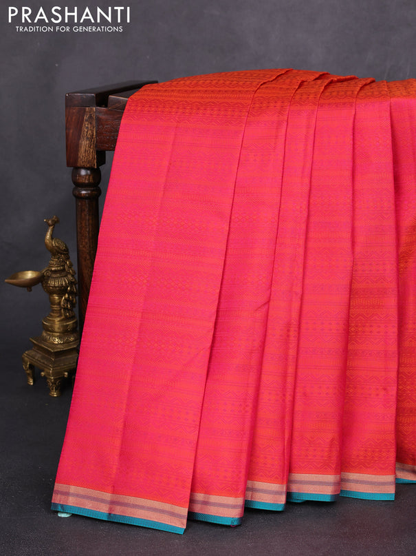 Pure kanchipuram silk saree dual shade of pinkish orange and teal green with allover self emboss and zari woven border