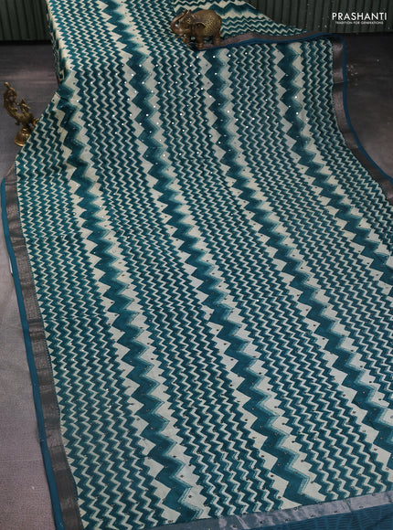 Chanderi silk cotton saree cream and peacock green with allover zig zag weaves & mirror work and zari woven border