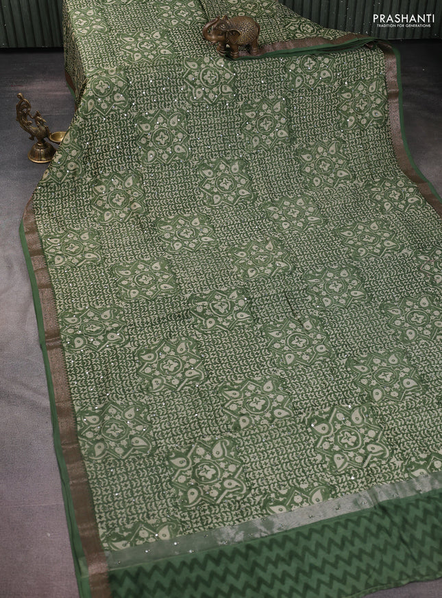 Chanderi silk cotton saree green shade with allover prints & mirror work and zari woven border