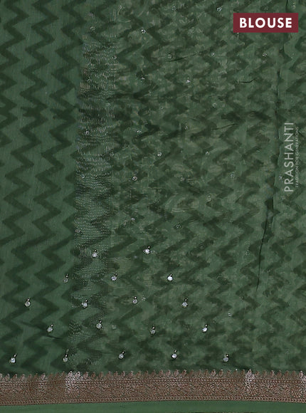 Chanderi silk cotton saree green shade with allover prints & mirror work and zari woven border