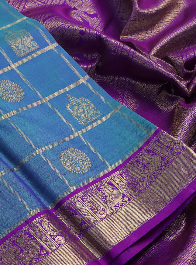 Pure kanchipuram silk saree blue shade and purple with allover zari checks & buttas and zari woven border