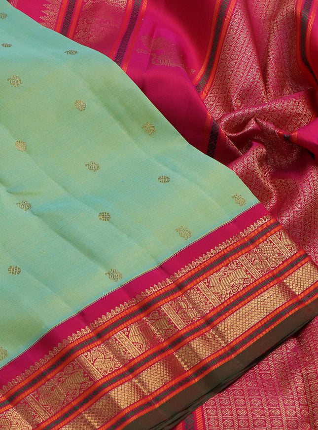 Pure kanchipuram silk saree teal green shade and pink with zari woven buttas and zari woven korvai border