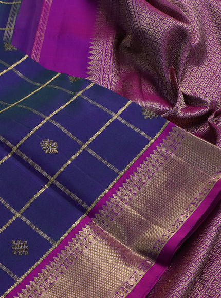 Pure kanchipuram silk saree dual shade of peacock blue and purple with allover zari checks & buttas and zari woven border