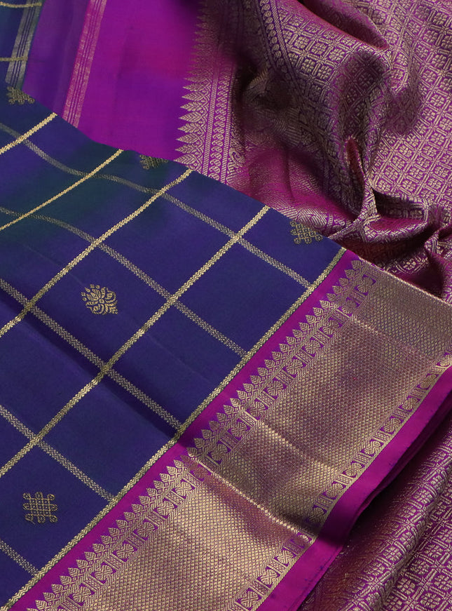 Pure kanchipuram silk saree dual shade of peacock blue and purple with allover zari checks & buttas and zari woven border