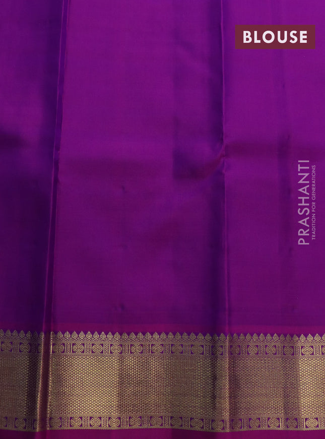 Pure kanchipuram silk saree dual shade of peacock blue and purple with allover zari checks & buttas and zari woven border