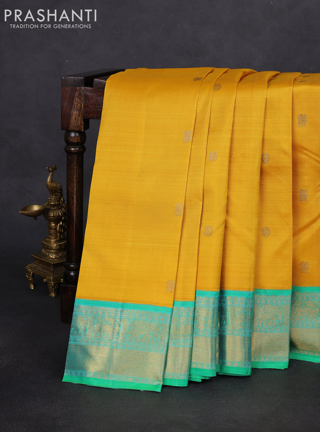 Pure kanchipuram silk saree mustard yellow and green with zari woven buttas and zari woven korvai border