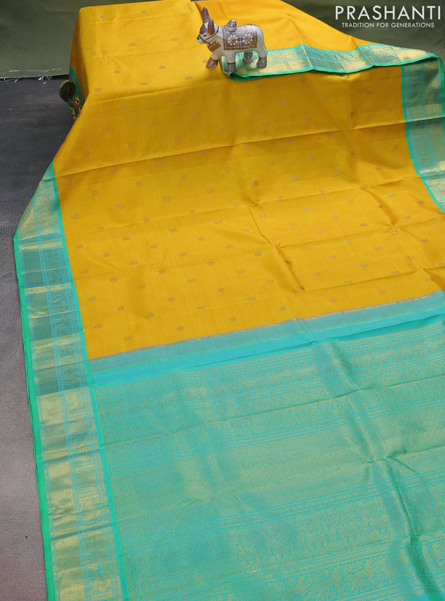 Pure kanchipuram silk saree mustard yellow and green with zari woven buttas and zari woven korvai border
