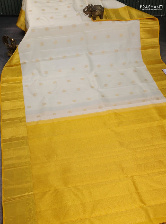 Pure kanchipuram silk saree off white and yellow with zari woven buttas and zari woven border