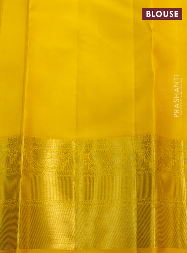 Pure kanchipuram silk saree off white and yellow with zari woven buttas and zari woven border