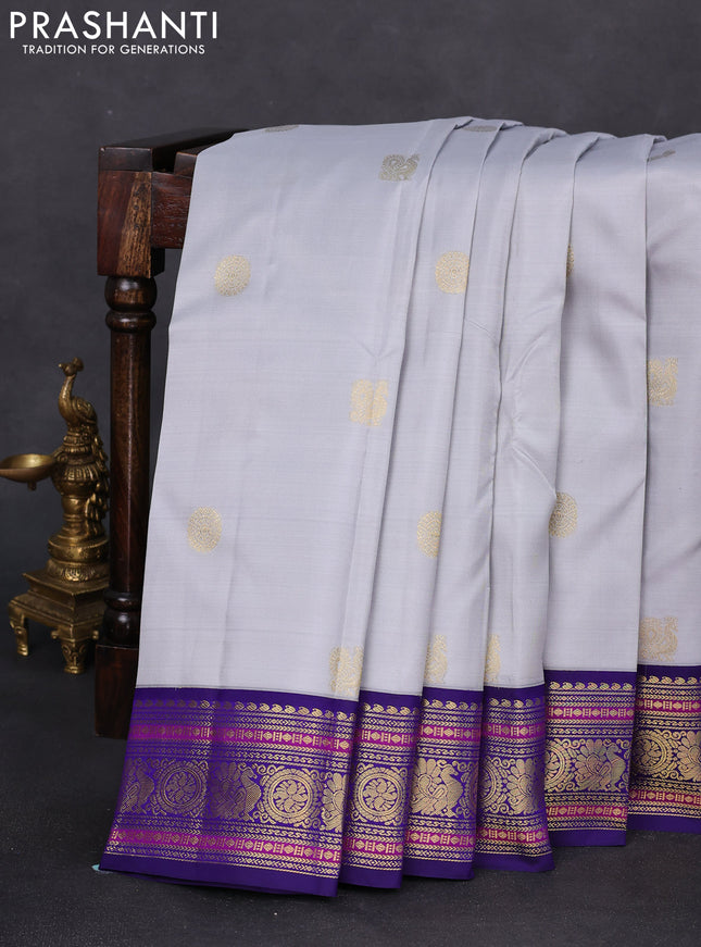 Pure kanchipuram silk saree pastel grey and blue with annam zari woven buttas and zari woven korvai border