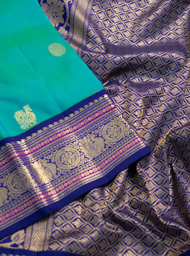Pure kanchipuram silk saree teal green and blue with annam zari woven buttas and zari woven korvai border