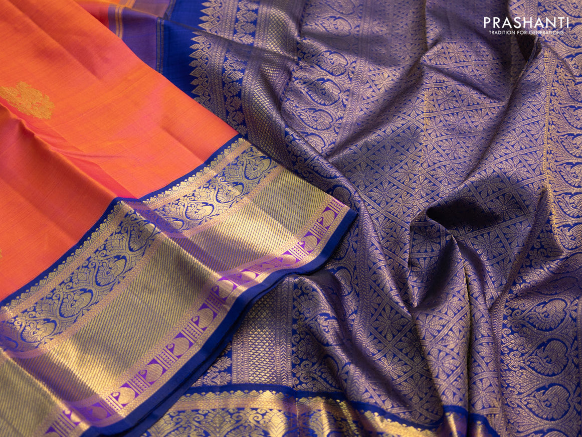 Pure kanchipuram silk saree dual shade of pinkish orange and blue with annam zari woven buttas and zari woven korvai border