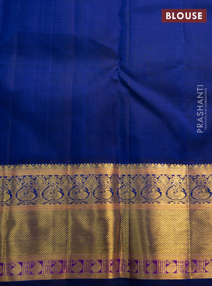 Pure kanchipuram silk saree dual shade of pinkish orange and blue with annam zari woven buttas and zari woven korvai border