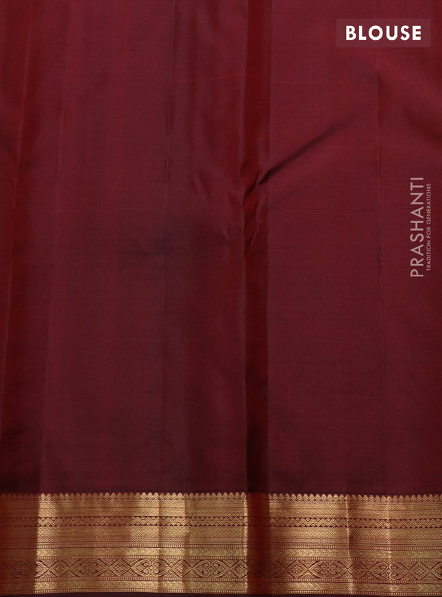 Pure kanchipuram silk saree deep maroon with allover zari checks & mayil chakram buttas and zari woven border