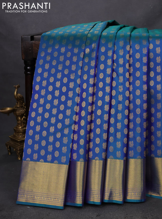 Pure kanchipuram silk saree peacock blue with allover annam & mayil chakram buttas and zari woven border