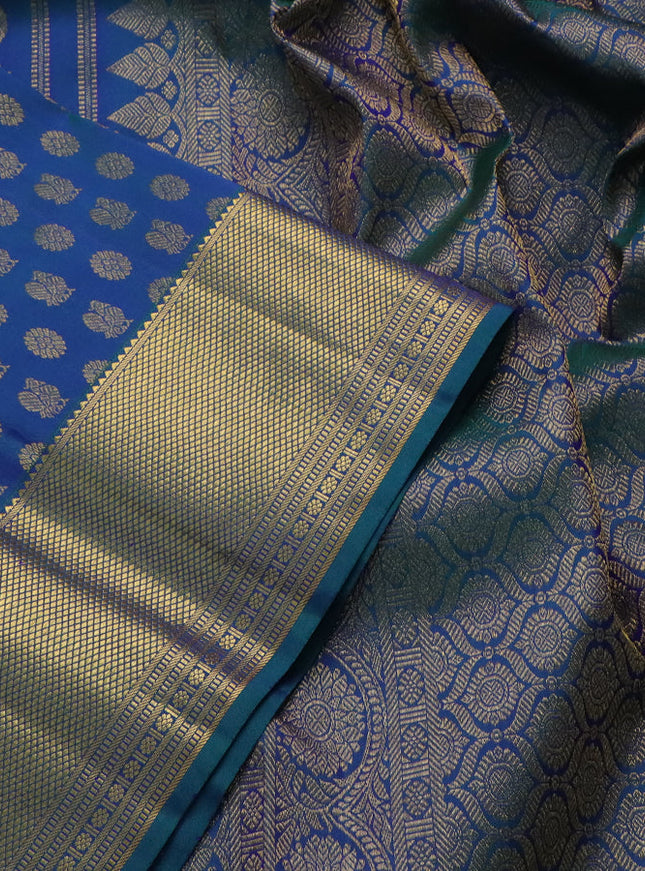 Pure kanchipuram silk saree peacock blue with allover annam & mayil chakram buttas and zari woven border