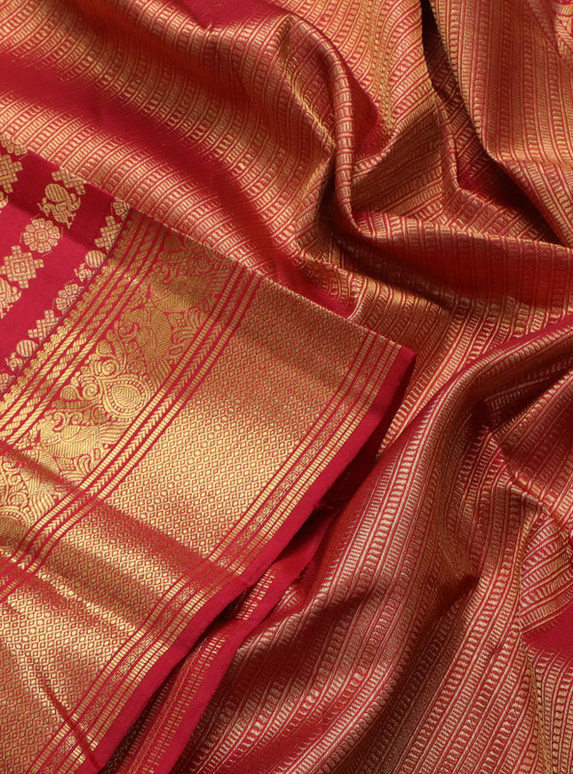 Pure kanchipuram silk saree maroon with allover annam & mayil chakram buttas and zari woven border