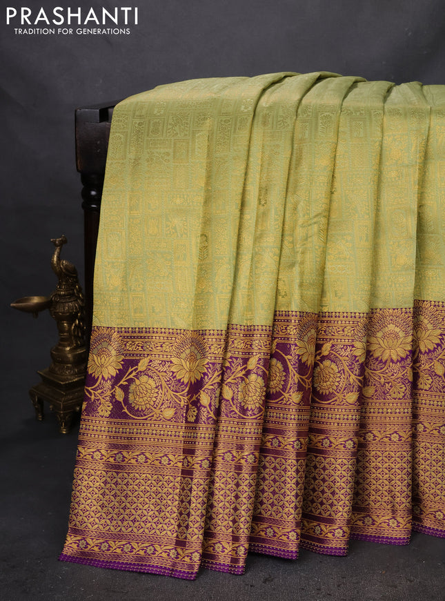Pure kanchipuram silk saree pista green and violet with allover zari woven brocade weaves and zari woven mina border