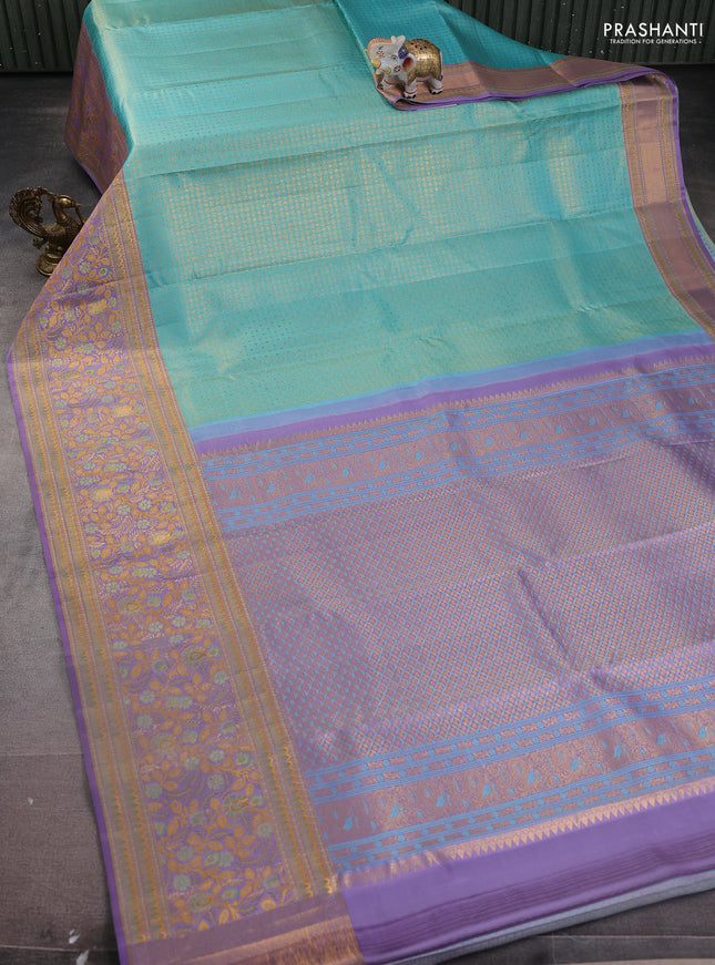 Pure kanchipuram silk saree teal blue and lavender with allover zari woven brocade weaves and zari woven mina border