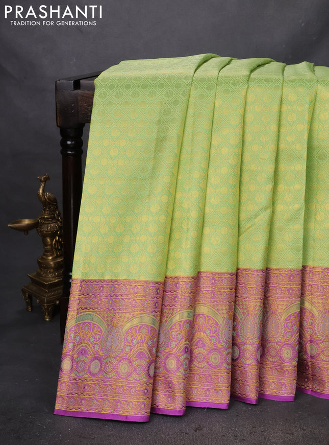 Pure kanchipuram silk saree pista green and purple with allover zari woven brocade weaves and zari woven mina border