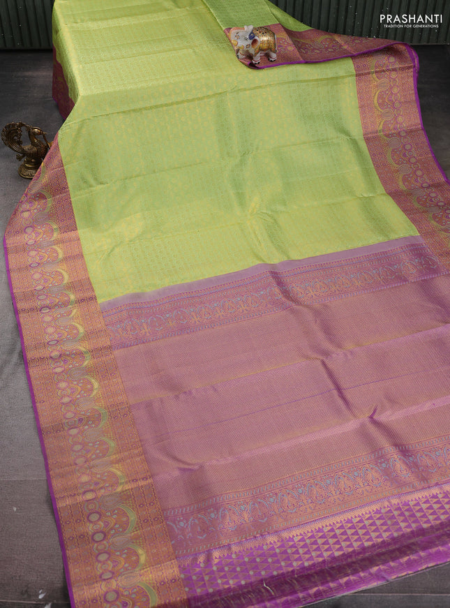 Pure kanchipuram silk saree pista green and purple with allover zari woven brocade weaves and zari woven mina border