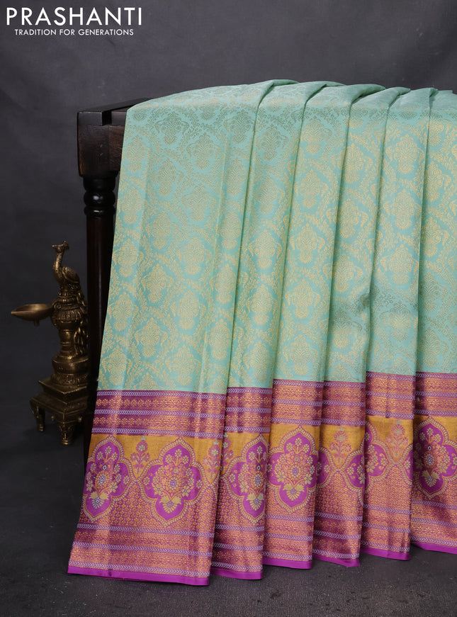 Pure kanchipuram silk saree pastel shade and purple with allover zari woven brocade weaves and zari woven mina border