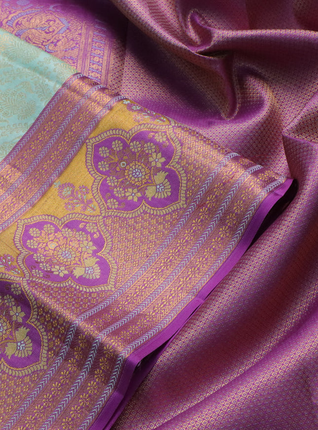 Pure kanchipuram silk saree pastel shade and purple with allover zari woven brocade weaves and zari woven mina border