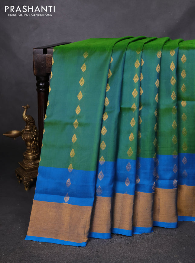 Pure uppada silk saree dual shade of green and cs blue with allover zari woven buttas and zari woven border