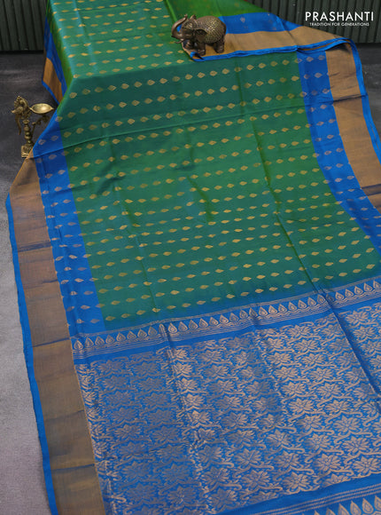 Pure uppada silk saree dual shade of green and cs blue with allover zari woven buttas and zari woven border